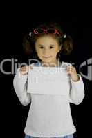 little girl holds a sheet of white paper