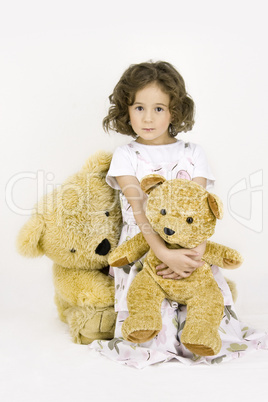 little girl with two teddy bears