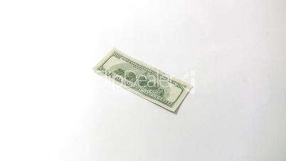 falling dollars on white background