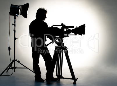 Cameraman silhouette and cameras.