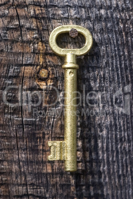 Old key of gold colour.