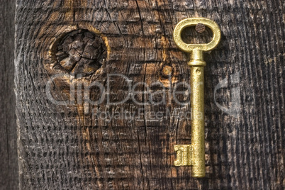 Old key of gold colour.