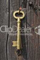 Old key of gold colour.