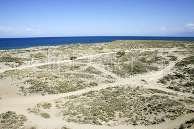 Sandy coast of lake.