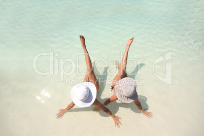 Woman lying in blue pool