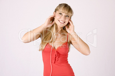 young blond woman listening to music