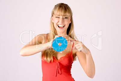 young blond woman offers a cd