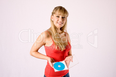 young blonde offers a media disc, a dvd or a cd