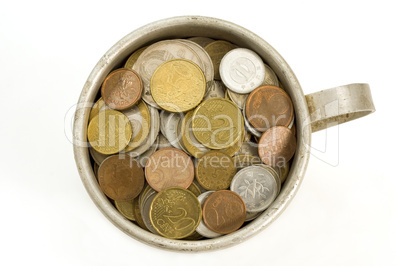Old aluminum mug and coins.