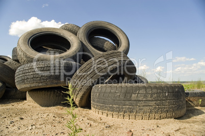 Heap of the old worn out automobile tyre covers.