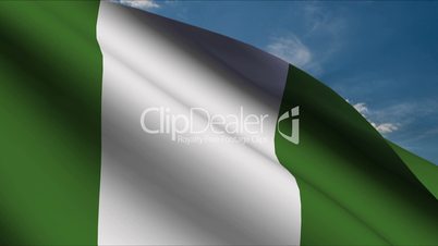 Nigerian Flag waving in wind with clouds in background