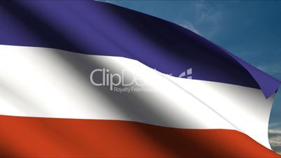 Yugoslavia Flag waving in wind with clouds in background