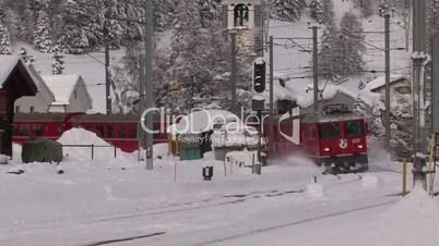 Swiss Train Passing By Station Bever
