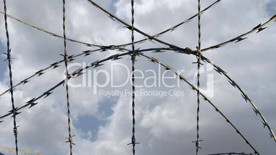 Barbed wire against sky Time lapse