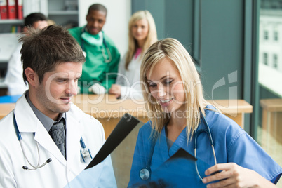 Doctors reading a document in hospital