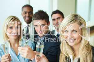 Businesspeople toasting with champagne