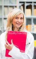 Nurse holding a pink folder