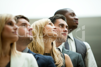 Businesspeople looking up
