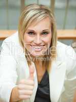 Businesswoman smiling with her thumb up