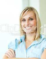 Businesswoman smiling with arms crossed