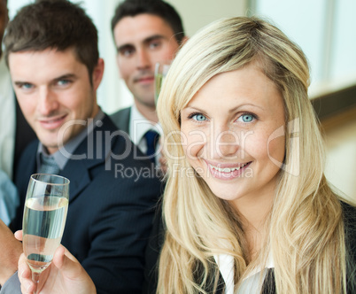 Businesspeople celebrating a success with champagne