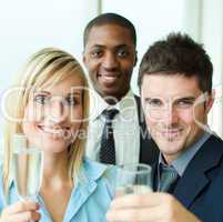 Portrait of businesspeople toasting with champagne