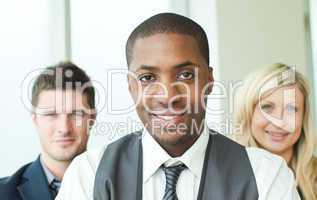 Portrait of an Afro-American businessman with his colleagues