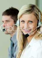 Two business people working with headsets