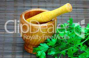 wooden mortar and herbs