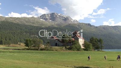 Castle And Hiker Near The Lake Of Silvaplana