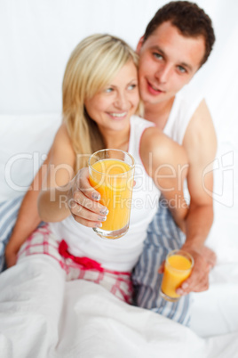 Woman holding a glass of orange juice