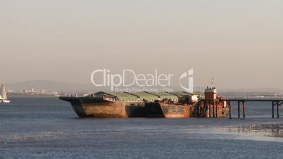 Barges moored in old industrial pier