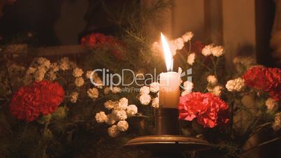 Candle decoration with bouquet of flowers