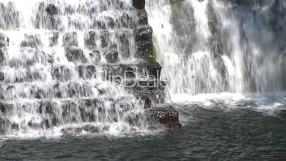 water falling over a dam