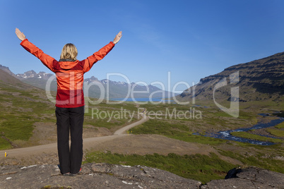 Woman Hiker Looking Down The Berufjordur Valley Iceland