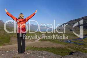 Woman Hiker Looking Down The Berufjordur Valley Iceland