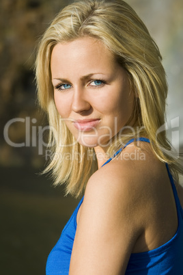 Beautiful Blond Woman In Blue Dress Bathed In Golden Sunshine