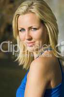 Beautiful Blond Woman In Blue Dress Bathed In Golden Sunshine