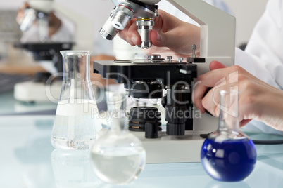 Scientist Using Microscope in a Medical Research Laboratory