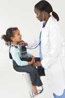 African American Female Doctor Examining Interracial Girl Child