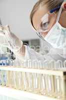 Female Scientist or Doctor In Surgical Mask In Laboratory