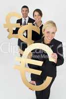 Businesswoman and Team With Currency Symbols Euro Dollar and Pou