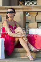 Beautiful Young Latina Woman Relaxing With Shopping Bags