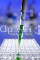 Green Solution Scientific Research With a Pipette and Cell Plate