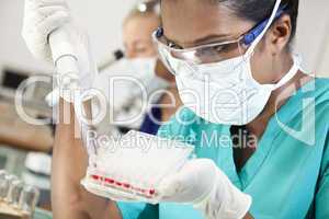 Asian Female Doctor Or Scientist In Laboratory With Blood Sample