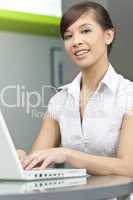 Beautiful Chinese Asian Woman Using A Laptop Computer