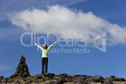 Woman Celebrating Achievement At The Top Of A Mountain