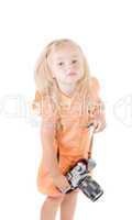 Shot of little girl with camera in studio