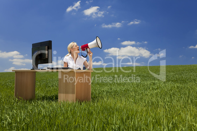 Woman With Computer Using Megaphone