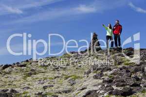 Couple Climbing A Mounatin